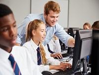 Image of pupils and teacher in a classroom