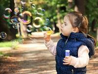 Image of a child blowing bubbles