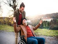 Carer and father in wheelchair