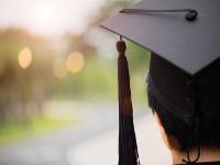 Image of student wearing a mortarboard on graduation