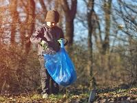 Image of a boy litter picking