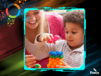 Image of lady watching young child building a tower