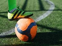 Image of a fooball on a pitch Image of a fooball on a pitch