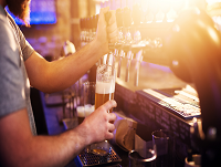 Image of a man pouring a pint