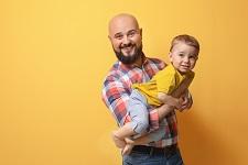 Father holding young child
