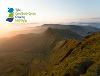 Image of Powys landscape and Growing Mid Wales logo