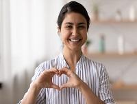 Woman making a heart symbol with her hands