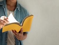Man reading aloud from a book