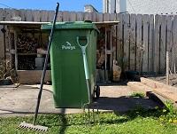 Image of a green bin in a garden