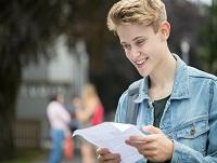 Image of teenage boy happy with exam results