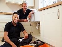 Tradesmen fitting a new kitchen