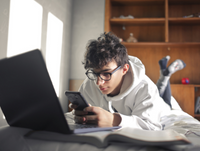 Image of young person on phone