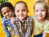 Three children with a yellow background