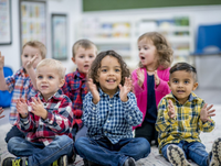 Children clapping on floor