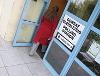 Image of a person walking into a polling station