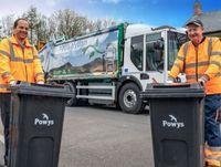 Image of two waste and recycling crew members 
