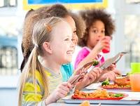 Children eating their dinner at school
