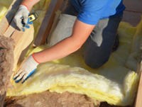 Image of person laying loft insultation