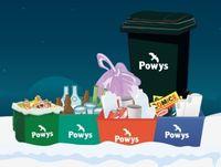 Image of recycling bins with a snowy background