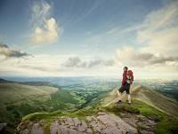 Image of a man walking on a hillside