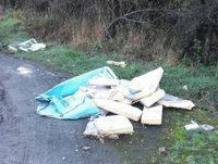 Image of fly tipped material on the A483 near Dolfor