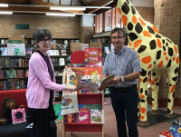 Councillor David Selby and Powys Senior Library Assistant Amanda Griffkin