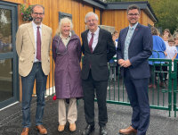 Image of Powys County Council’s Leader, Cllr James Gibson-Watt, joins Cabinet Member for Future Generations, Cllr Sandra Davies and Deputy Leader Cllr Matthew Dorrance to welcome the First Minister of Wales to the new setting