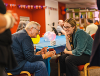 Image of people chatting in a community centre