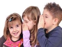 Image of three children whispering Image of three children whispering