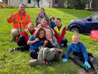 A community clean-up on the Treowen housing estate in Newtown which was organised as part of Caru Powys and included children from Treowen Primary School