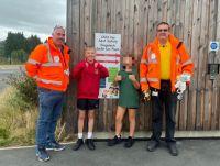 Image of the car seat height chart, school pupils and road safety officers