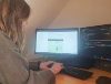 Digital developer Nikki Baird-Murray working on Powys County Council’s Supply Chain Sustainability Portal.
