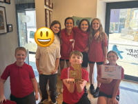 Image of pupils from Brynhafren C.P. School celebrate winning the Year 5 and 6 English-medium category of the Book Slam competition