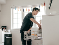 Young person in kitchen