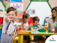 Image of a happy boy giving a thumbs up