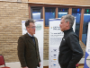 Image of Cllr Jake Berriman, Leader of Powys County Council, talking to David McKnight, from SVWMS, at the SVWMS drop-in session held at Bettws Village Hall.