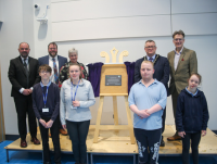 Image of learners and adults at the official opening of Ysgol Robert Owen