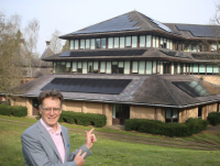 Image of Leader Cllr Jake Berriman outside County Hall where solar photovoltaic (PV) panels have been installed by the council.