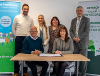 Russell Brown, Shaw Healthcare’s Chief Executive Officer and Nina Davies, Powys County Council’s (PCC) Director of Social Services and Wellbeing signing the new 15-year contract. With them are back row, from left to right: Geraint Evans, Shaw’s Operations
