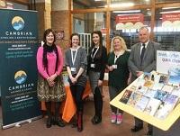 Image of staff from Cambrian Credit Union meeting Powys County Council staff