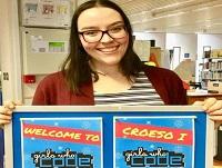 Image of someone holding a "Girls who code" sign
