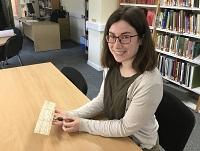 Image of archivist Julie Ryan holding the title deed