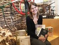 Image of a lady holding some books Image of a lady holding some books