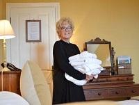 Image of a lady holding bedding
