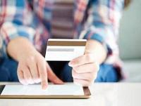 Image of someone paying with a card