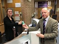 Image of Cllr Stephen Hayes receiving a ‘Message in a Bottle’