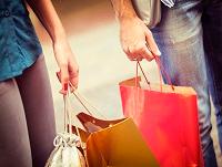 Image of people carrying shopping bags