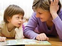 Image of a woman reading to a child