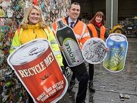 Image of a group of people with promotional recycling props