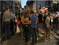 Image of people standing in street in Builth Wells